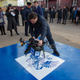 An organizer places a mail delivery drone before a test launch,in Ulan-Ude, on April 2, 2018.